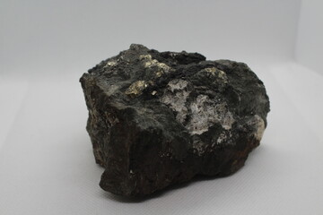 Pyrite in a rock isolated on a white background. natural silver pyrite gem on white background....