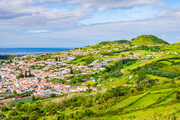 View of Horta town and green hills on coast of Faial island, Azores, Portugal, Faial island, Azores, Portugal
