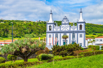 Traditional style old church in green tropical landscape near Almoxarife beach, Faial island, Azores, Portugal
