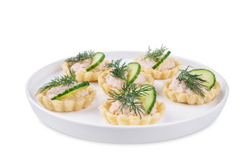 Salmon mousse tartlets in a plate on a white isolated background