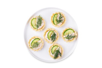 Salmon mousse tartlets in a plate on a white isolated background