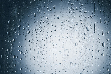 Many water drops on glass surface, closeup