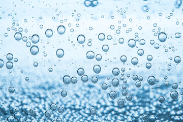 Soda water with bubbles as background, closeup