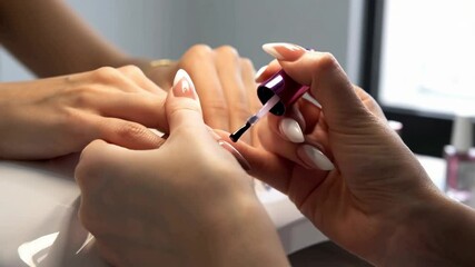Hands display elegant nail art at a beauty studio