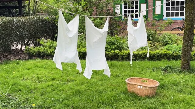laundry day, linen is hanging outdoor on clothesline