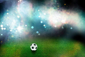 Soccer ball on green grass at football stadium, space for text
