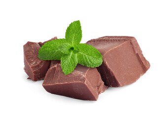 Milk chocolate chunks and mint leaves on white background
