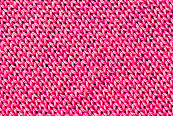 Pink knitted wool fabric background (texture). Flat lay, top view