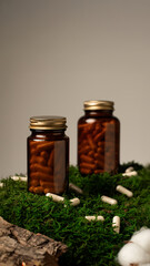 Herbal supplement capsules in amber jars on natural background. For natural, organic, and eco-friendly lifestyle, suitable for themes of wellness, alternative medicine,  and plant-based health product