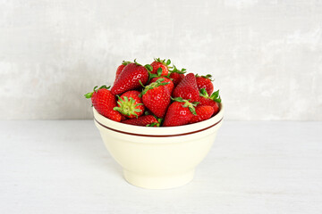 Bowl with fresh strawberries