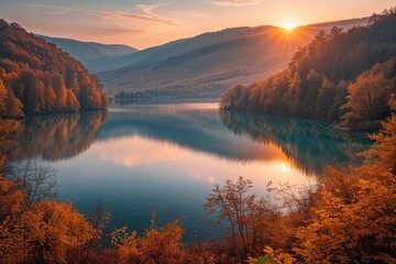 Fototapeta premium Stunning Sunrise Over Lacu Rosu Lake: Exquisite Autumn Landscape in Romania's Harghita County