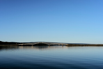 Obraz premium Nessundet truss bridge in Lake Mjøsa seen from the Helgøya Island in April 2025.