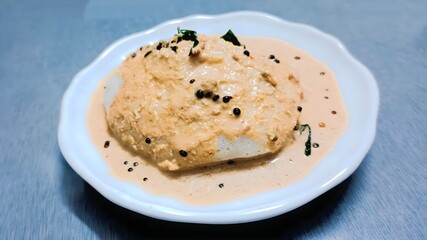 Steamed soft idli served with flavorful coconut chutney, tempered with mustard seeds and curry leaves for a South Indian twist.