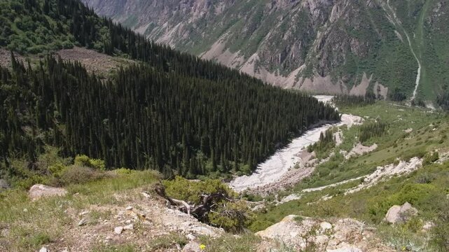 This footage captures the romantic atmosphere of Ala Archa National Park, Kyrgyzstan, showcasing its mountains and valleys under soft, romantic lighting.