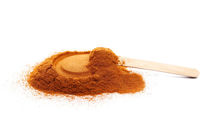 Pile spicy chili red pepper in wooden spoon, milled dry paprika isolated on white, side view