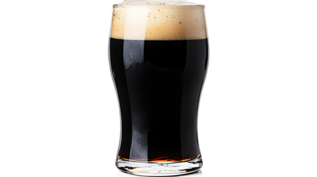 A glass of beer is full and has foam on top. The foam is white, and the beer is dark
