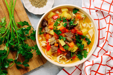 Traditional Uzbek dish lagman made from vegetables, meat and noodles .
