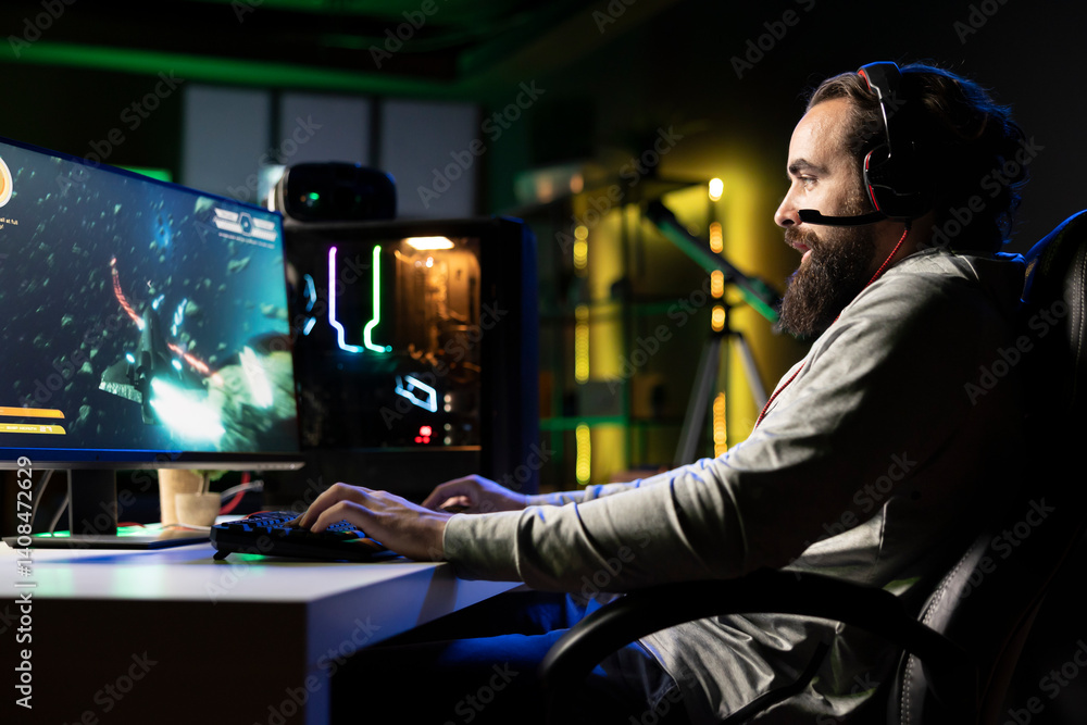 Aufkleber upbeat man having fun with his friends playing videogames, chatting online using headphones micropho