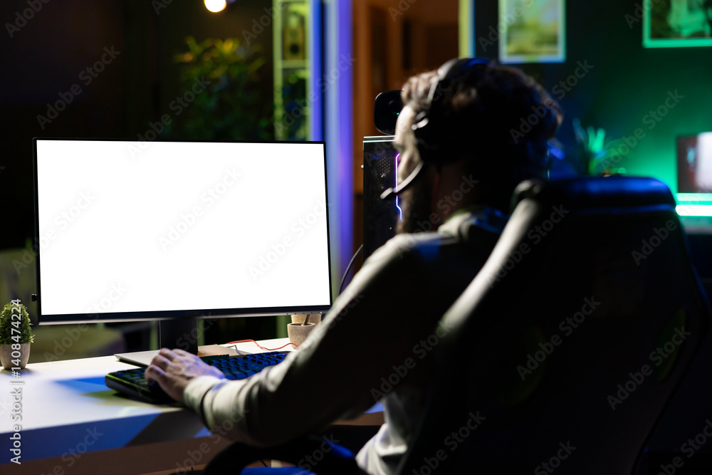 Poster man having fun by using isolated screen computer monitor to play singleplayer videogame. professiona