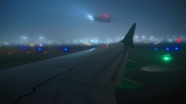 Airport LAX, Los Angeles, California, USA - MARCH 18, 2025: The captivating view seen from an airplane window as it taxis slowly through dense fog and rain following a smooth landing process