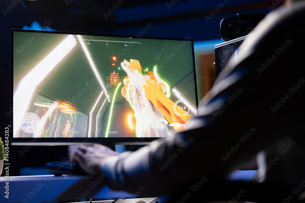 Poster man playing sf fps videogame, having fun in dark apartment room, using gaming computer peripherals. 