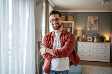 Portrait of smiling freelancer working from home office