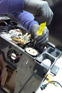 Professional repair and cleaning technician for coffee machine parts with a sprocket grinder for whole bean and espresso, both commercial and home. Internal parts. Boiler. Cleaning.