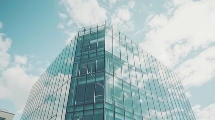 Contemporary Glass Building with Clear Sky and Cloud Reflections