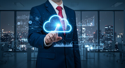 Businessman finger pressing glowing cloud icon, surrounded by floating data graphs and analytics