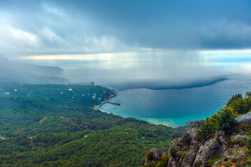 stunning view of the Crimean coast from above. In the foreground you can see a rocky area covered...