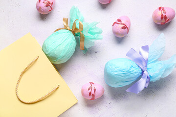 Shopping bag with Easter eggs on lilac grunge background