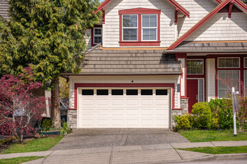 Fragment of  luxury house in spring with green trees and nice landscape in Vancouver, Canada, North America. Day time on April 2025.