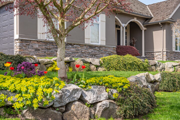 Fragment of  luxury house in spring with green trees and nice landscape in Vancouver, Canada, North America. Day time on April 2025.