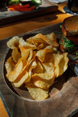 potato chips on tray with bit sandwich at restaurant