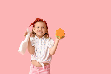 Cute little happy girl with bottle of detergent and sponge on pink background