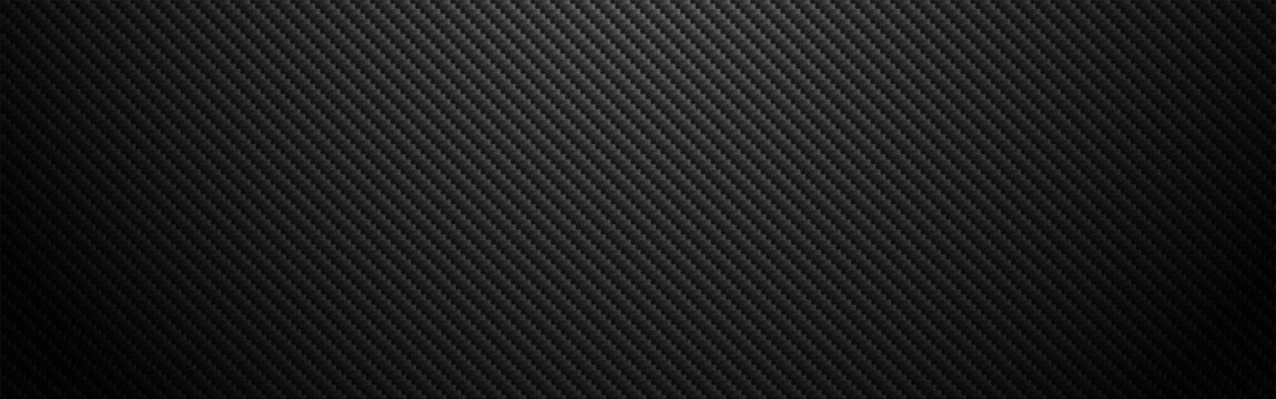 Carbon fiber texture with realistic shadow effect. Dark composite material. Wide industrial material for poster or banner. Black diagonal cloth. Vector illustration.