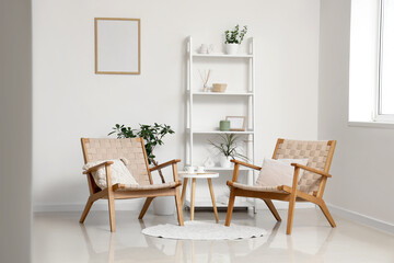 Interior of modern stylish living room with armchairs and shelving unit