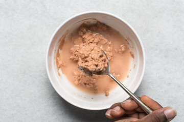 Overhead view of nigerian akamu or pap paste, process of making akamu, flatlay of process of making nigerian akamu ogi pap or guinea corn pudding