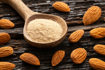 Prunus dulcis - Ground dried almonds in a spoon