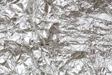 Crumpled aluminium foil as background, closeup