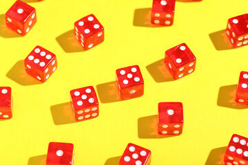 Red game dices on yellow background