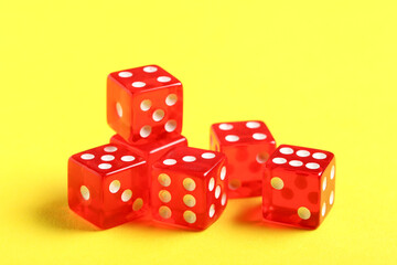 Red dices on yellow background