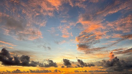 Calm sea with sunset sky and sun through clouds above. Meditation sea and sky background. Tranquil sea view. Horizon over the water.