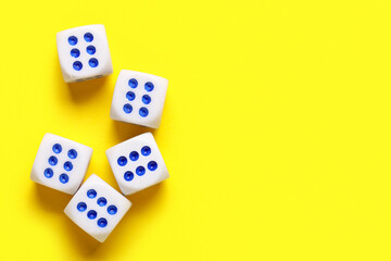 Dices with red and blue pips on yellow background