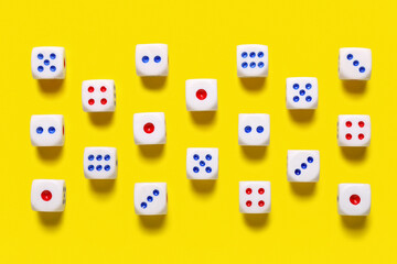 Dices with red and blue pips on yellow background