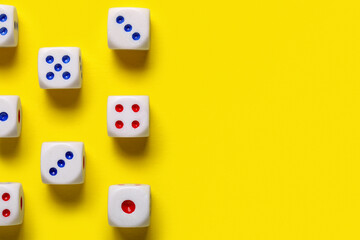 Dices with red and blue pips on yellow background