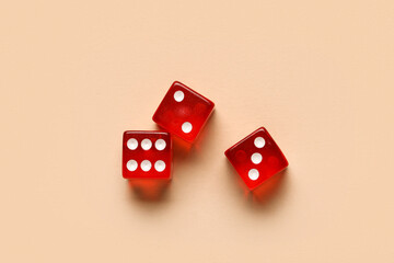 Red dices on beige background