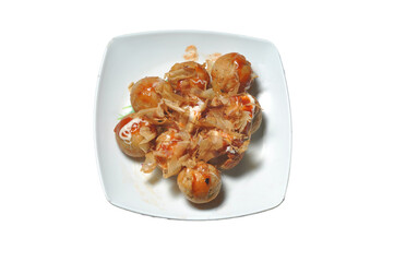 Takoyaki is a typical Japanese food in the form of balls and made from wheat flour dough filled with octopus.