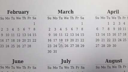 marking March 25 date on the calendar	
