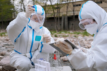 Scientists Conducting Field Research on Environmental Samples with Precision and Care